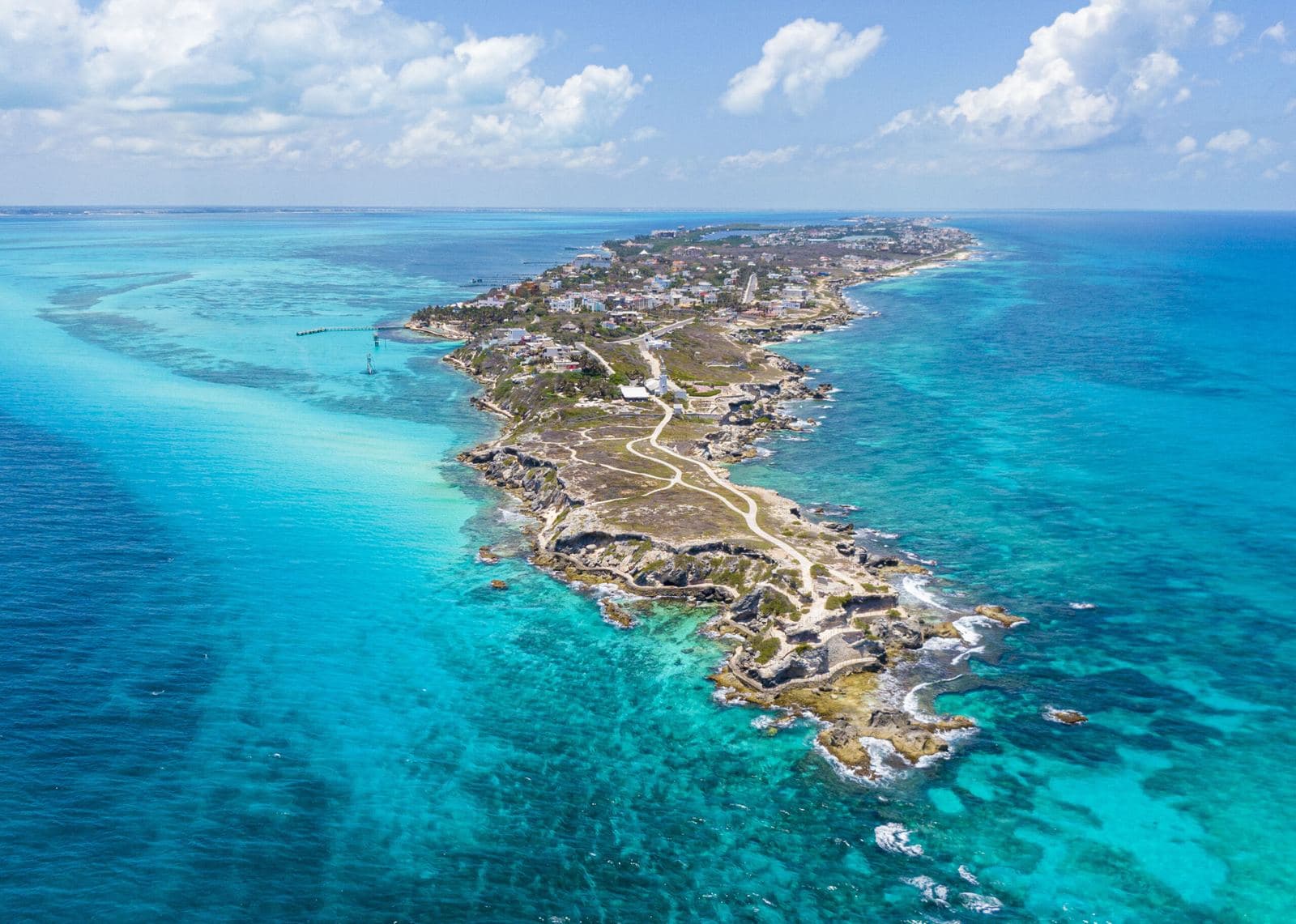 Aerial view of Isla Mujeres surrounded by turquoise sea