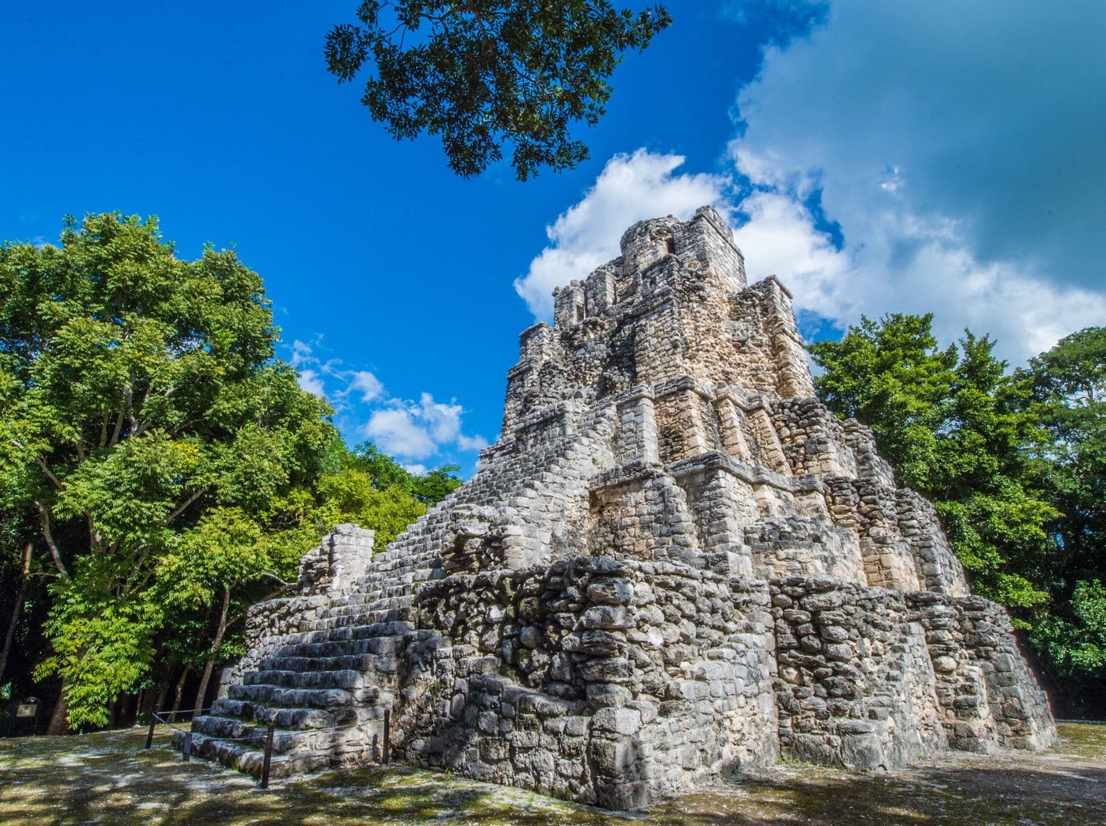 Maya pyramid surrounded by jungle in Maya Ka'an