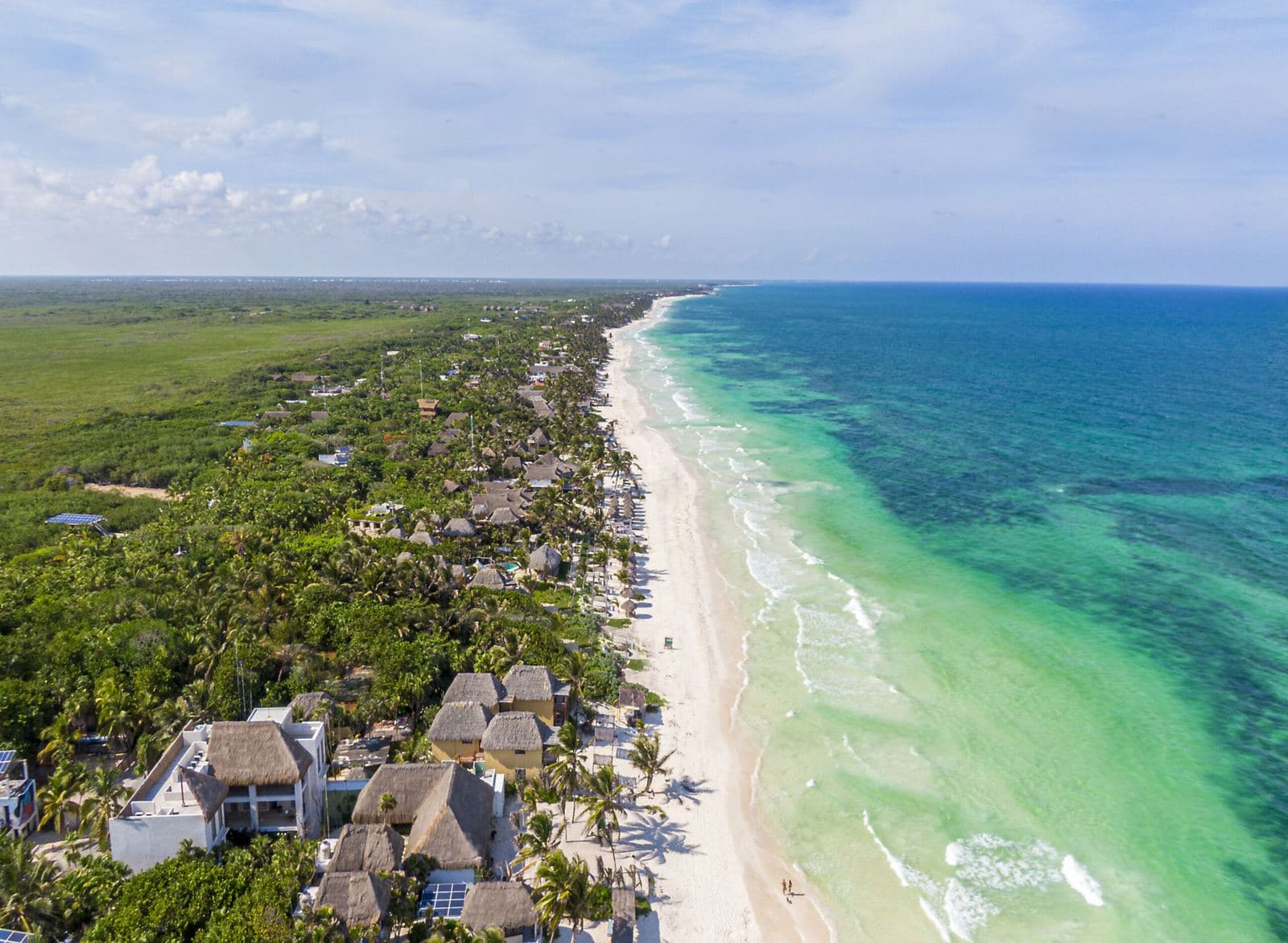 Aerial view of a white-sand beach on the Riviera Maya